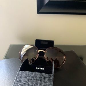 Brown Prada sunglasses. Excellent condition.